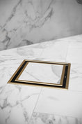 Load image into Gallery viewer, Upgrade your shower with our Solid Brass Tile Insert Drain. This 115x115x35mm drain features a brushed brass gold finish, combining functionality with a sleek, modern design. Durable and stylish for any bathroom.-Floor Waste-Ezymall AU
