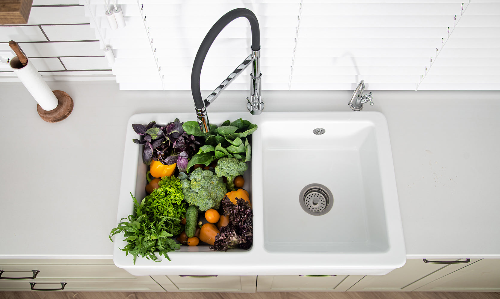 Kitchen sink positioned to suit the surrounding benchtop and layout
