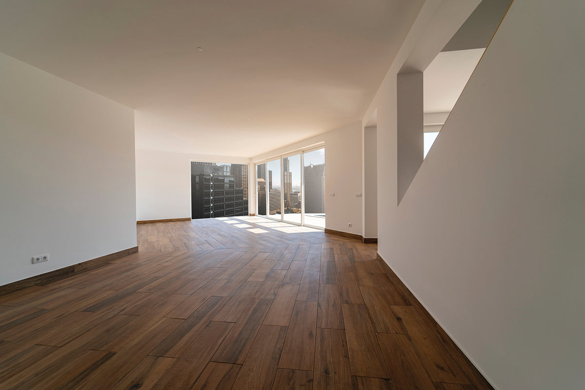 New timber flooring installation in a bright open-plan home interior