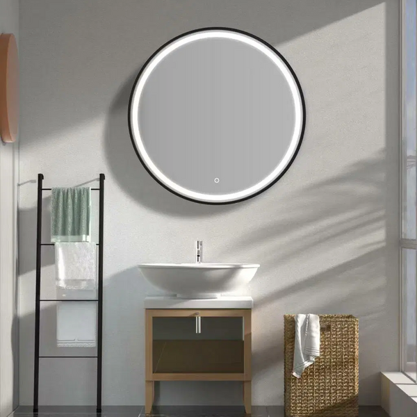 Bathroom interior with a round illuminated mirror, sink, and towel rack.