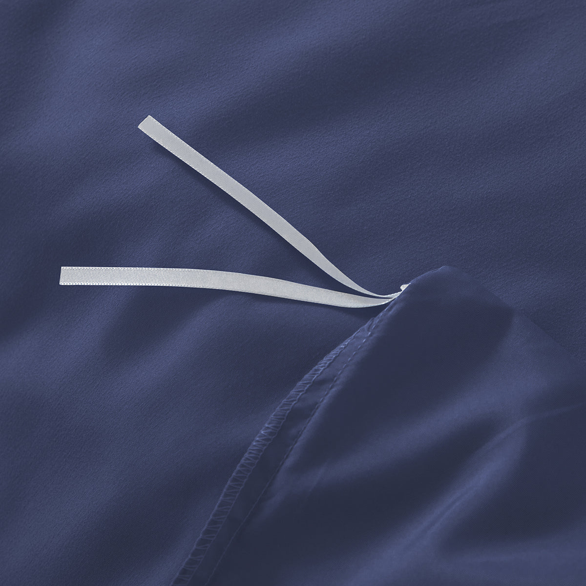 Internal corner ties inside the navy blue premium cotton quilt cover
