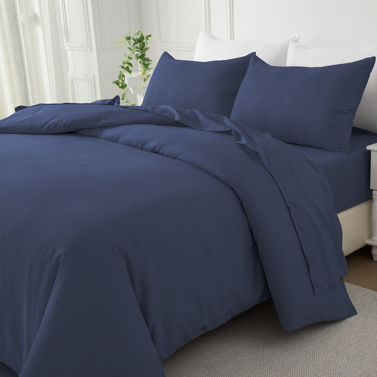 Navy blue premium cotton quilt cover set styled on a bed