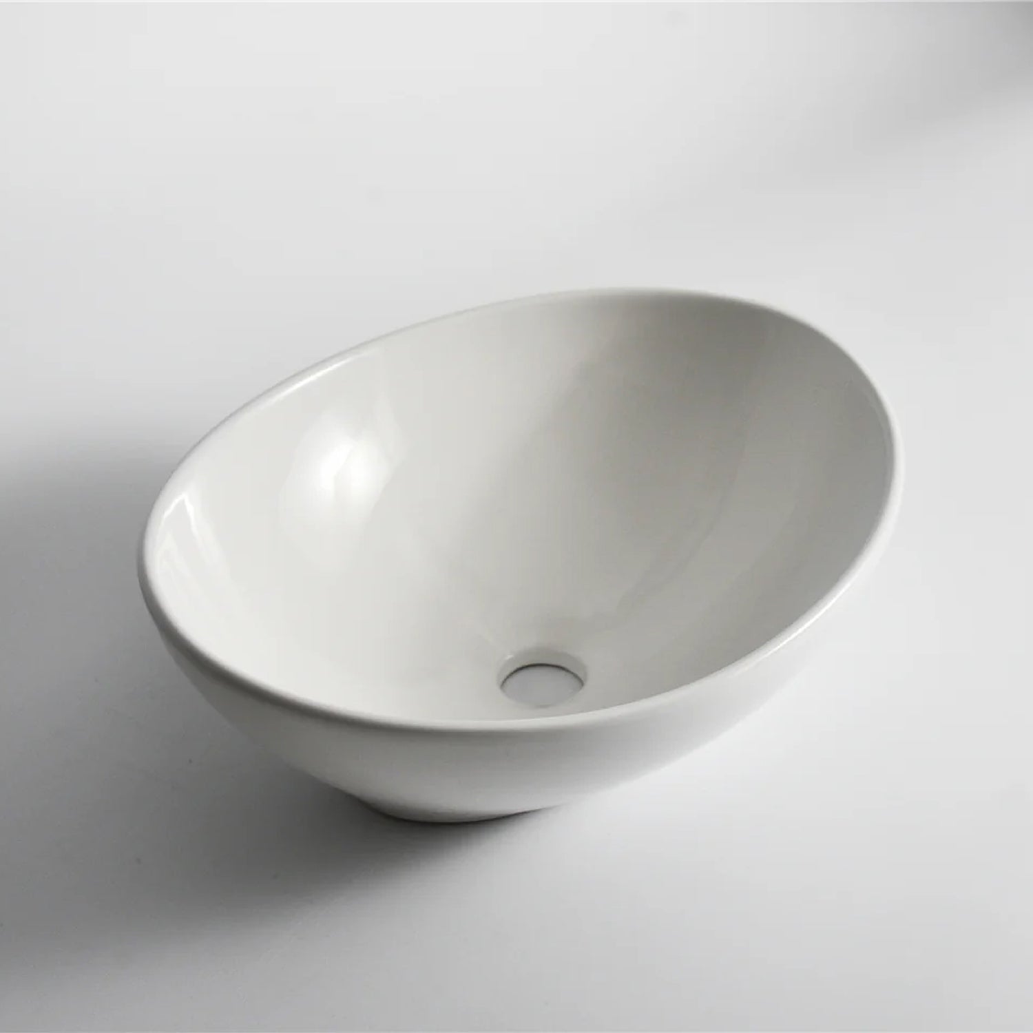 CLAYA Oval-40 above counter basin in gloss white ceramic. 410mm oval basin with non-overflow waste, ideal for modern bathroom vanities.-Basin Sink-Ezymall AU