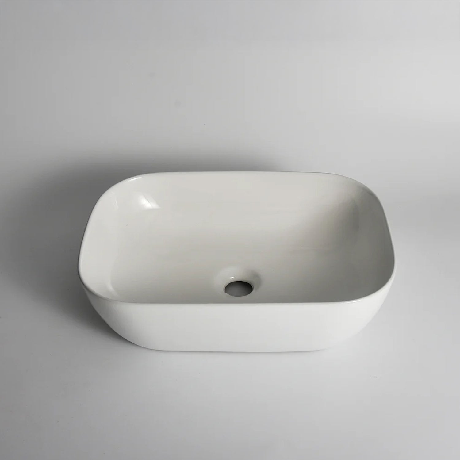 CLAYA Oval-46 above counter basin in gloss white ceramic. 460mm oval basin with non-overflow waste, ideal for modern bathroom vanities.-Basin Sink-Ezymall AU