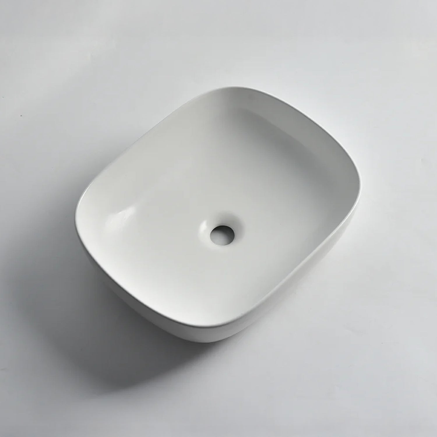 CLAYA Oval-48 above counter basin in matte white ceramic. 485mm oval basin with non-overflow waste for modern bathroom vanities.-Basin Sink-Ezymall AU
