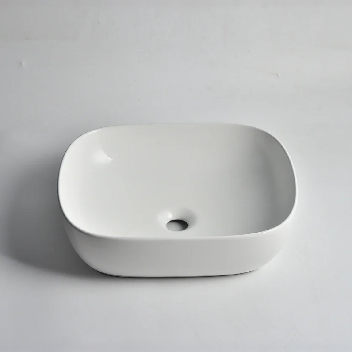 CLAYA Oval-48 above counter basin in matte white ceramic. 485mm oval basin with non-overflow waste for modern bathroom vanities.-Basin Sink-Ezymall AU