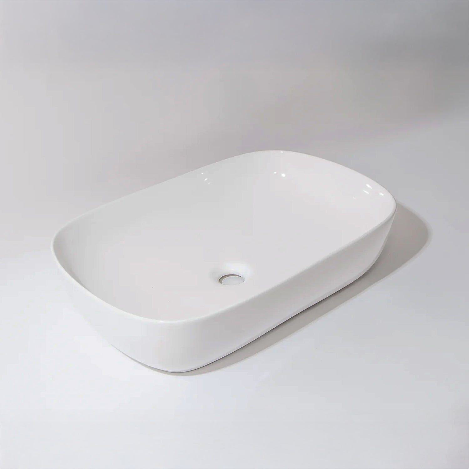 CLAYA Oval-60 above counter basin in gloss white ceramic. Large 610mm oval basin with non-overflow waste for modern bathroom vanities.-Basin Sink-Ezymall AU