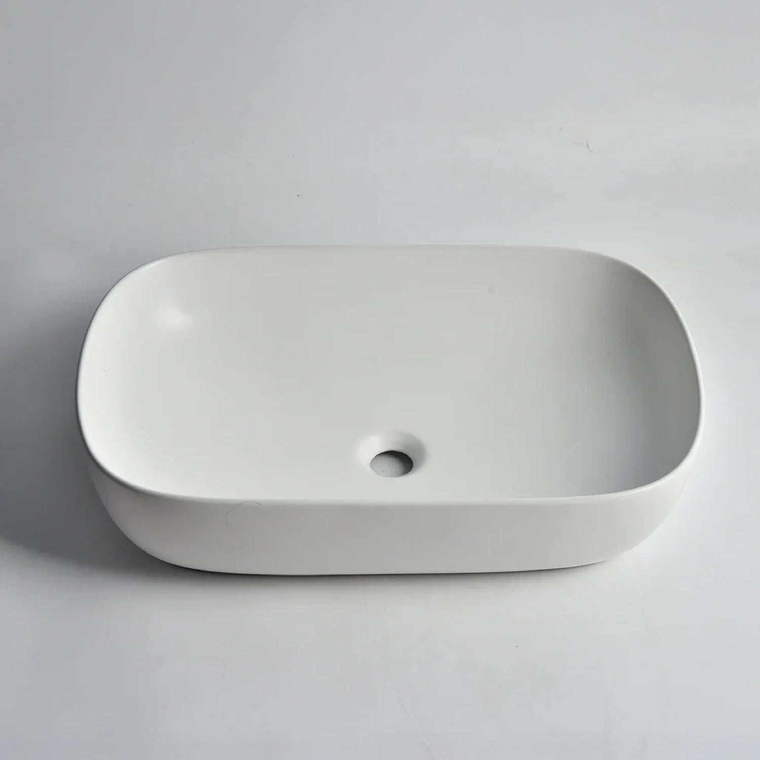 CLAYA Oval-60 above counter basin in gloss white ceramic. Large 610mm oval basin with non-overflow waste for modern bathroom vanities.-Basin Sink-Ezymall AU