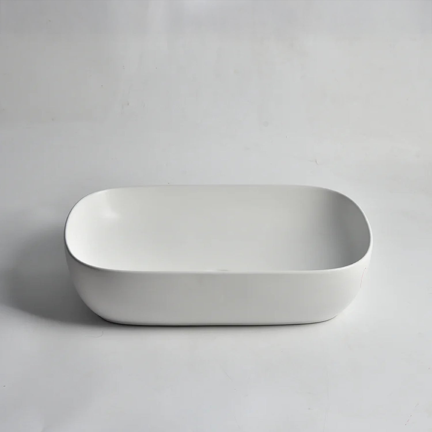 CLAYA Oval-60 above counter basin in matte white ceramic. Large 610mm oval basin with non-overflow waste for modern bathroom vanities.-Basin Sink-Ezymall AU