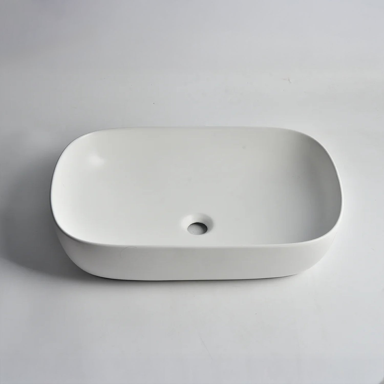 CLAYA Oval-60 above counter basin in matte white ceramic. Large 610mm oval basin with non-overflow waste for modern bathroom vanities.-Basin Sink-Ezymall AU