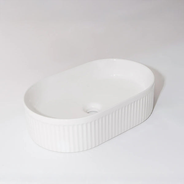 CLAYA Pill-49 fluted above counter basin in gloss white ceramic. 490mm oval basin with vertical fluting and overflow for modern bathrooms.-Basin Sink-Ezymall AU