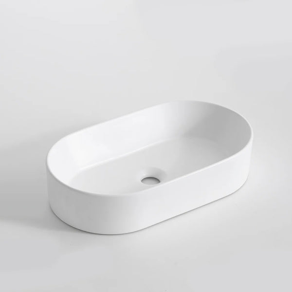 CLAYA Pill-52 above counter basin in matte white ceramic. Slim 525mm oval basin with non-overflow waste for modern bathroom vanities.-Basin Sink-Ezymall AU