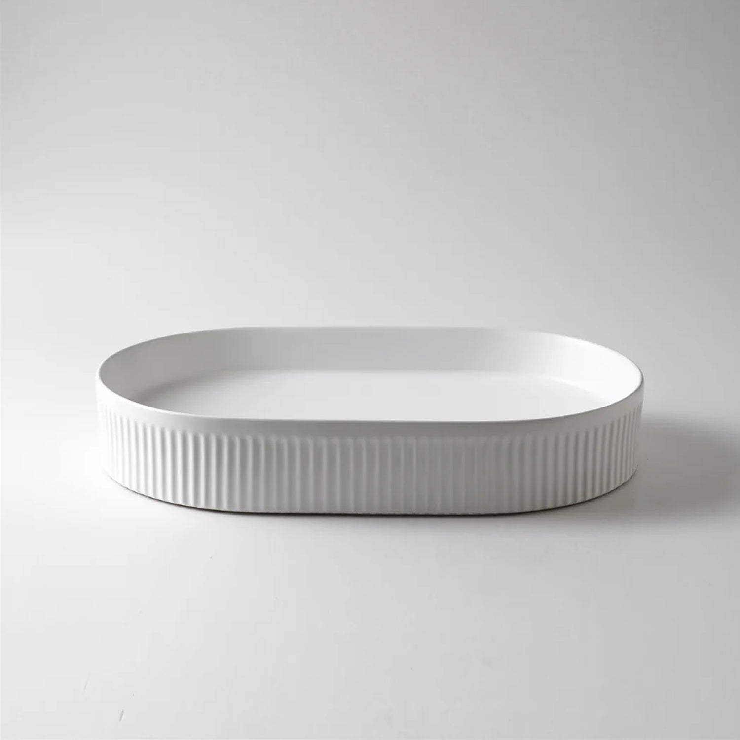 CLAYA Pill-58 fluted above counter basin in gloss or matte white ceramic. 580mm oval basin with non-overflow waste for modern bathrooms.-Basin Sink-Ezymall AU