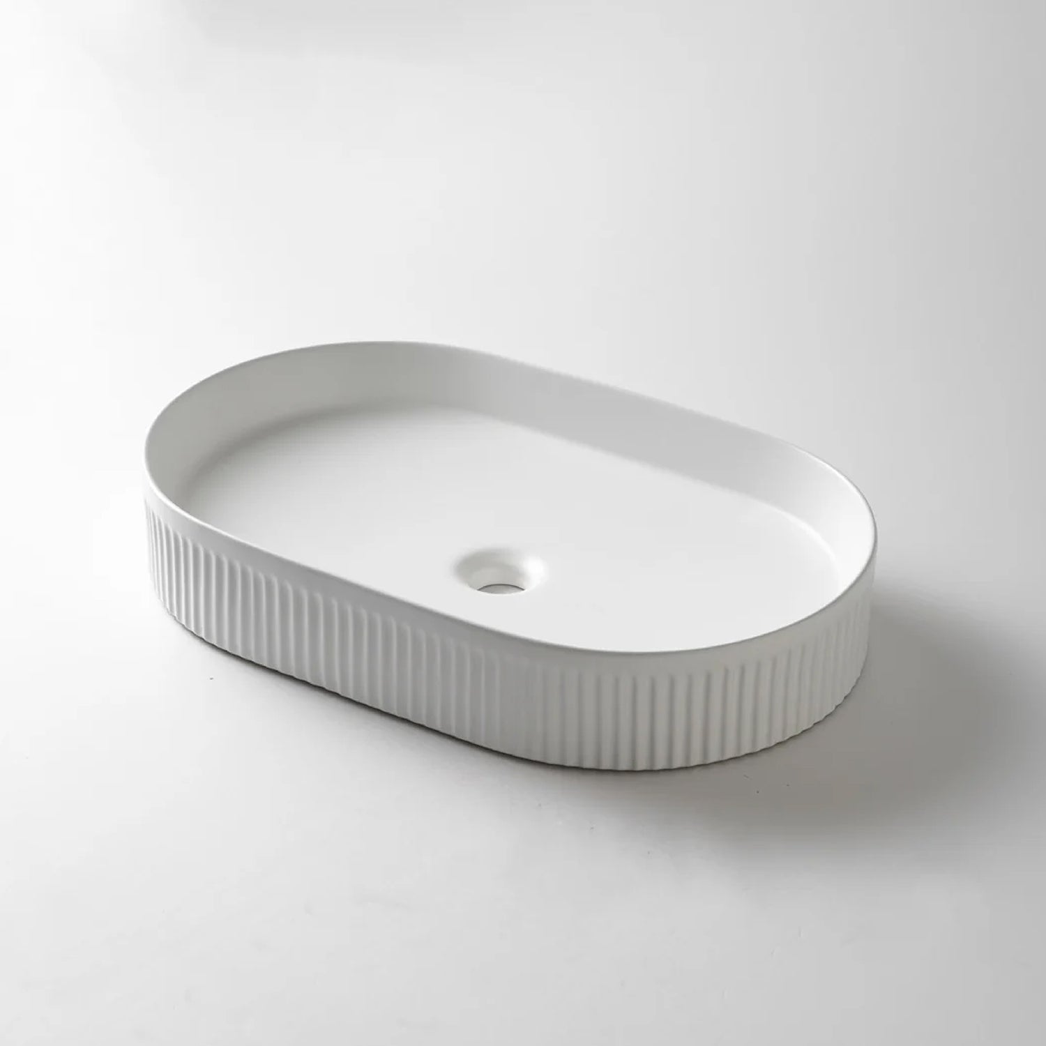 CLAYA Pill-58 fluted above counter basin in gloss or matte white ceramic. 580mm oval basin with non-overflow waste for modern bathrooms.-Basin Sink-Ezymall AU