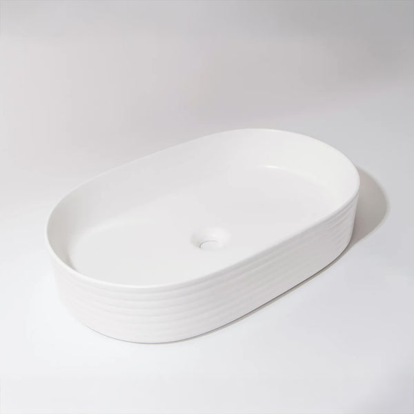 CLAYA Pill-60 fluted above counter basin in matte white ceramic. 605mm oval basin with non-overflow waste for modern bathroom vanities.-Basin Sink-Ezymall AU