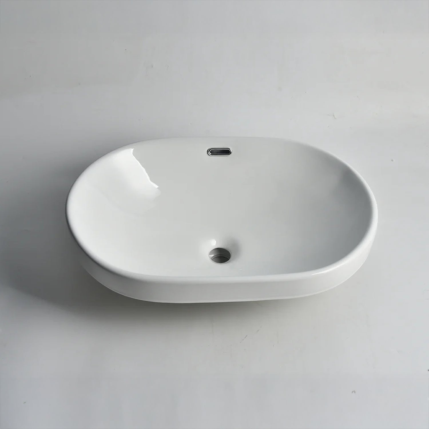 CLAYA SEMI-60 semi-inset basin in gloss white ceramic. 605mm oval basin ideal for modern and family bathroom vanities.-Basin Sink-Ezymall AU