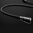 Load image into Gallery viewer, Brushed nickel pull-out kitchen tap nozzle with a flexible black braided hose on a reflective black surface.
