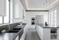 Load image into Gallery viewer, Brushed nickel pull-out kitchen mixer tap installed on a dark stone benchtop in a modern white kitchen.
