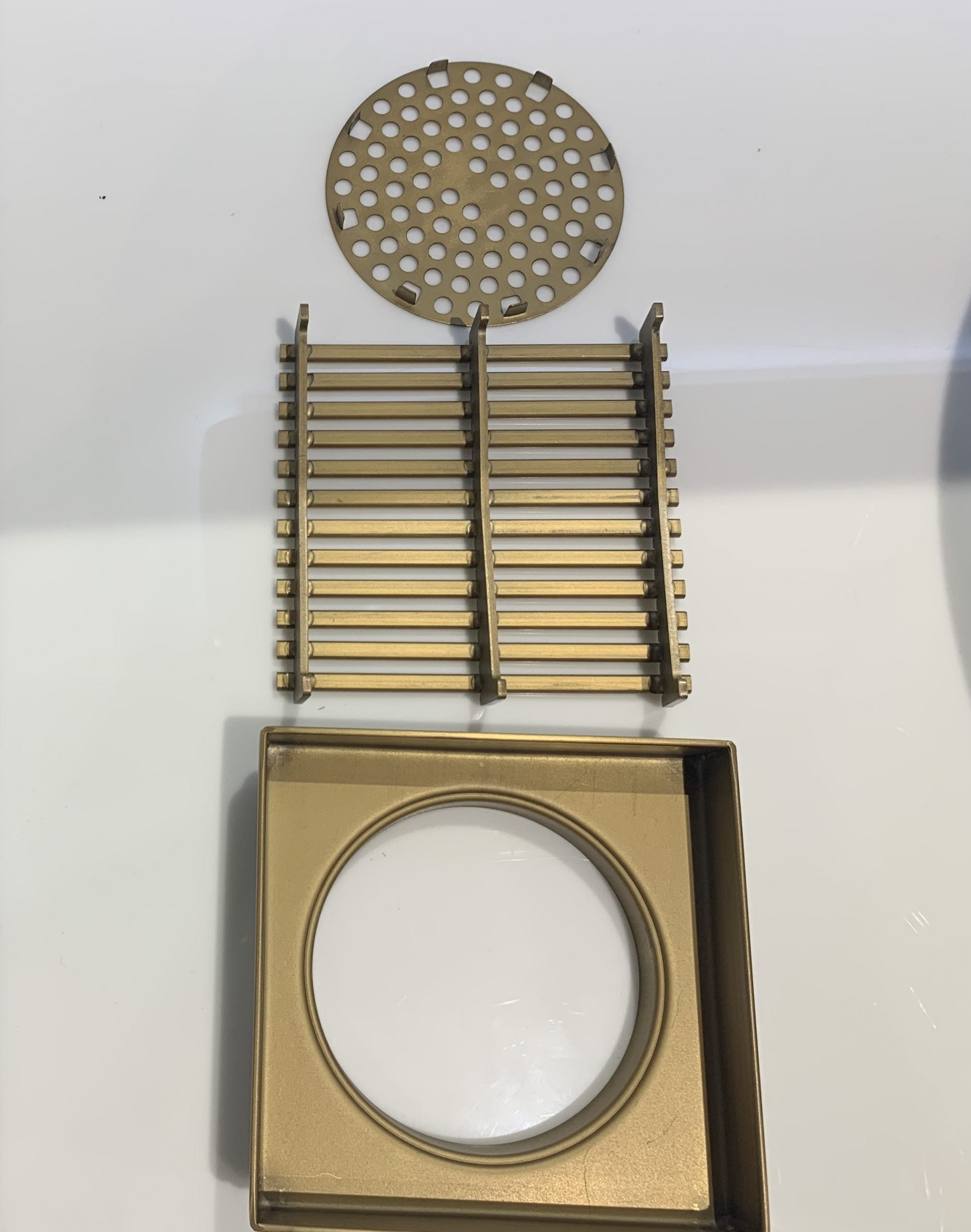 Install the Stainless Steel Grill Floor Waste Shower Grate Drain in Brushed Brass Gold (115x115x30mm). Stylish and functional, this drain prevents clogging and adds elegance to your shower. Shop now!-Floor Waste-Ezymall AU