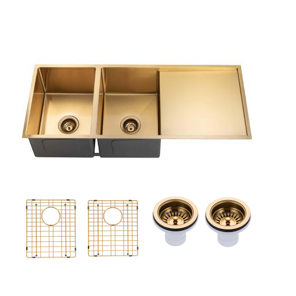 A double-basin kitchen sink with a brushed gold finish and a matching right-side tray, shown with two drain assemblies and two wire grids on a plain white background.