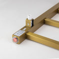 Load image into Gallery viewer, Side view of Brushed Brass Gold stainless steel 4-bar square heated towel rail
